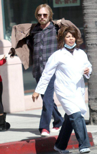 petty Tom Petty walking with a nurse outside an L.A. doctor's office.